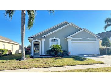 Charming single-story home with a well-manicured lawn and attached two-car garage at 16732 Glenbrook Blvd, Clermont, FL 34714
