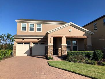 Charming two-story home featuring a two-car garage and well-maintained landscaping at 6806 Trellis Vine Loop, Windermere, FL 34786