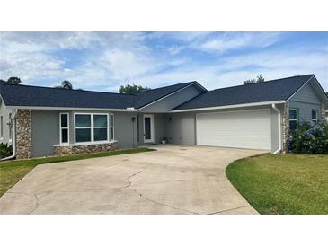 Beautiful single-story home featuring a two-car garage and neutral paint scheme at 804 Wildwood Cir, Port Orange, FL 32127
