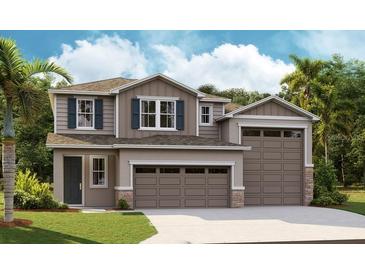 Charming two-story home featuring a two-car garage, neutral color palette, and complementary landscaping at 1007 Wisteria Way, Dundee, FL 33838