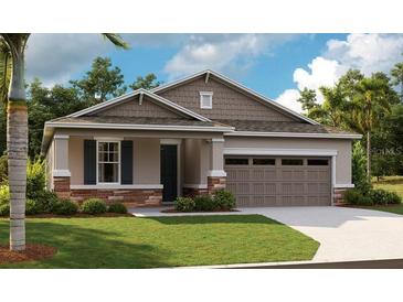 Charming single-Gathering home featuring stone accents, neutral siding, and a two-car garage at 808 Wekiva Ridge Dr, Mount Dora, FL 32757