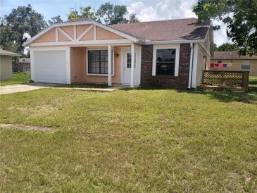 Charming single-story home with brick accents and a well-maintained front yard at 8750 Se 88Th Ave, Ocala, FL 34472