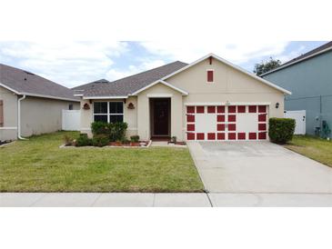 Charming single-Gathering home with manicured lawn and a two-car garage in a suburban neighborhood at 3690 Maidencain St, Clermont, FL 34714