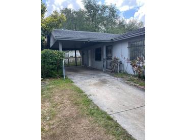 Exterior view of home with a covered carport and driveway at 2071 Liston Ct, Orlando, FL 32811