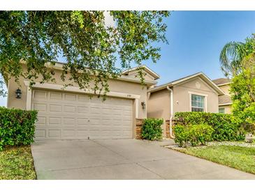Charming one-story home with a two-car garage and well-maintained landscaping at 3589 Cortland Dr, Davenport, FL 33837
