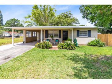 Charming single-story home with a well-maintained lawn and covered front porch, offers inviting curb appeal at 512 Maryland Ave, St Cloud, FL 34769