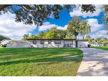 Charming single-story home with a well-maintained lawn and inviting curb appeal at 502 Engel Dr, Orlando, FL 32807