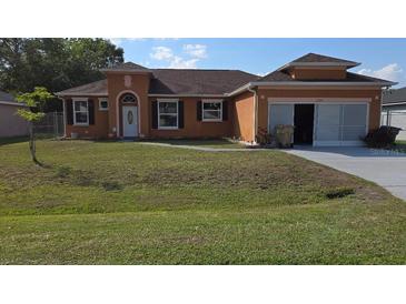 Charming one-story home with a well-maintained lawn and inviting curb appeal at 1107 Dartford Dr, Kissimmee, FL 34758