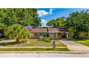 Charming single-story home with a covered carport and landscaped front yard at 1209 Marygon St, Kissimmee, FL 34744