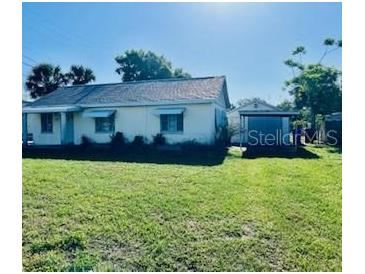 A charming single-story house with a spacious front yard, perfect for outdoor activities and curb appeal at 1309 N Thacker Ave, Kissimmee, FL 34741