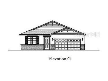 Charming single-story home with a two-car garage and decorative detailing along the roofline at 159 Waterstone Loop, Tavares, FL 32778
