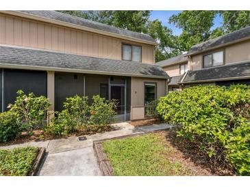 Charming townhouse with a screened lanai and landscaped front entrance at 411 Sheoah Blvd # 33, Winter Springs, FL 32708