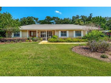 Charming home featuring manicured landscaping and a welcoming facade at 1096 Dyson Dr, Winter Springs, FL 32708