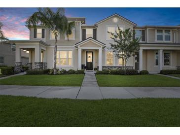 Charming two-story townhouse with landscaped front yard, inviting entrance and curb appeal at 2151 Valencia Blossom St, Clermont, FL 34711