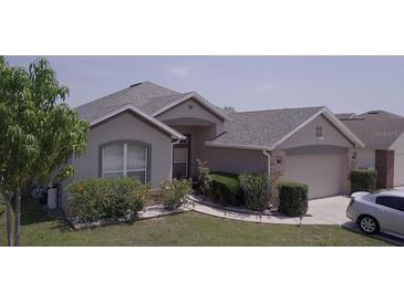 Charming single-story home featuring a well-maintained lawn and inviting curb appeal at 939 Jaybee Ave, Davenport, FL 33897