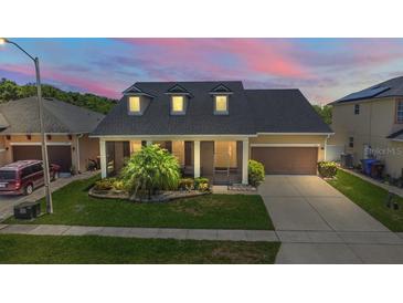 Charming single-Gathering home with a well-maintained lawn and landscaped garden at 1723 Brassie Ct, Kissimmee, FL 34746