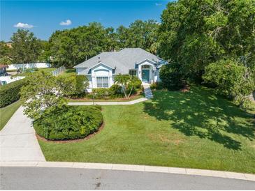 Charming single-story home with a well-manicured lawn and mature trees in a tranquil neighborhood setting at 2376 Nightingale Ln, Kissimmee, FL 34746