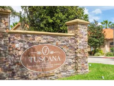 Stone entrance sign for the Toscana Orlando Mediterranean Inspired Garden Condominiums community at 1375 Tuscana Ln # 1405, Davenport, FL 33896