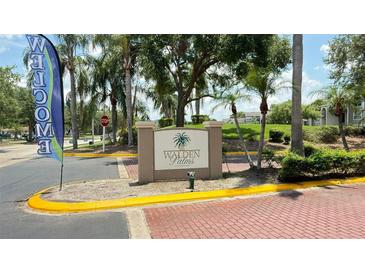 Welcoming entrance to Walden Palms, showcasing lush landscaping and a welcoming community vibe at 4728 Walden Cir # 32, Orlando, FL 32811