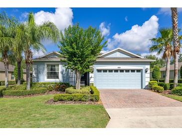 Charming single-Gathering home featuring a two-car garage and well-manicured landscaping at 3606 Solana Cir, Clermont, FL 34711