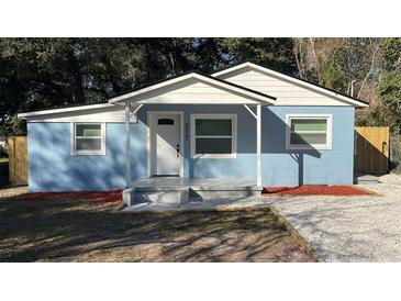 Charming blue exterior with a covered entryway and newly landscaped front yard offers great curb appeal at 217 W Chelsea St, Deland, FL 32720