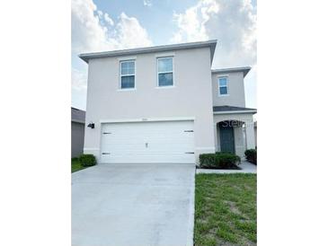 Charming two-story home with a two-car garage, manicured lawn, and appealing curb appeal at 2915 Turnstone, St Cloud, FL 34773