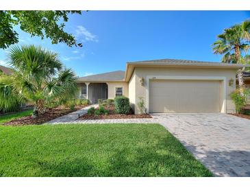 Beautiful single story home with well-maintained landscaping, paver driveway and walkway, plus a two-car garage at 214 Verona Dr, Kissimmee, FL 34759