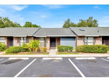Charming one-story townhouse with well-maintained landscaping and assigned parking spaces at 2907 Prince Oak Ct, St Cloud, FL 34769