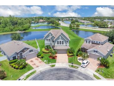 Beautiful two-story home on a cul-de-sac with lush landscaping and a view of the lake at 2255 Stone Lake Ct, Orlando, FL 32824