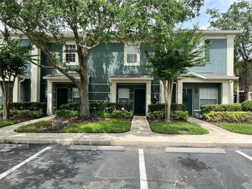 Charming two-story townhouse with a well-manicured lawn and parking at 3664 Wilshire Way Rd # 261, Orlando, FL 32829