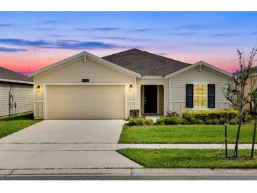 Charming one-story home with a well-manicured lawn and two car garage, perfect for suburban living at 4492 Bluff Oak Loop, Kissimmee, FL 34746