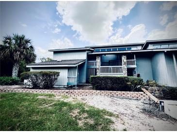 Inviting exterior view of charming home with manicured landscaping and a spacious porch at 806 Pinewood Ct # 3135/6, Haines City, FL 33844