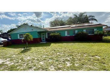 Charming one-story home with solar panels, well-manicured lawn, and brick accents at 2266 Lake Lizzie Ct, St Cloud, FL 34771