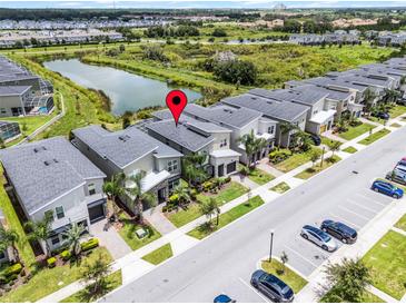 A lovely neighborhood with a stunning pond view and neat lawns gives this home great curb appeal at 661 Drop Shot Dr, Davenport, FL 33896