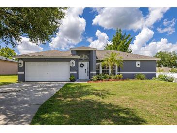 Charming single-story home with a well-manicured lawn and inviting curb appeal at 138 Hidden Pointe Ln, Groveland, FL 34736