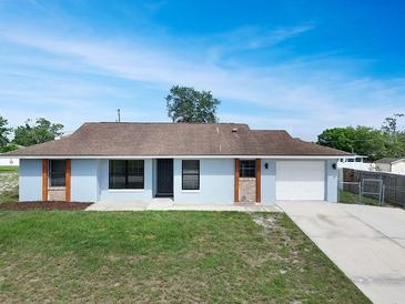 Charming single story home featuring a well-maintained lawn and attached one car garage at 925 Roswell Ter, Deltona, FL 32738