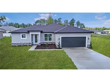 Beautiful single-Gathering home with a well-manicured lawn and a two-car garage at 4476 Sw 149Th St, Ocala, FL 34473