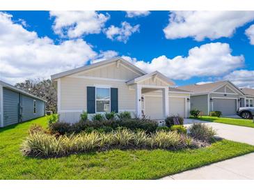 Charming single-story home featuring a well-manicured lawn and inviting curb appeal at 1959 Cricket Cradle Dr, Kissimmee, FL 34746