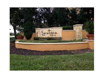 Well-maintained community sign surrounded by lush landscaping at 6137 Metrowest Blvd # 308, Orlando, FL 32835