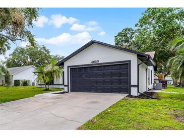 Charming single-Gathering home with a well-maintained lawn and a two-car garage perfect for suburban living at 3623 Tree Line Way, St Cloud, FL 34769