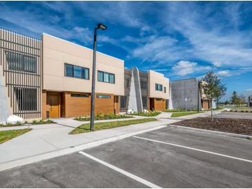 Modern townhomes with neutral colors and wood accents are available, offering contemporary living with ample parking at 5573 Torino Rd, Kissimmee, FL 34746