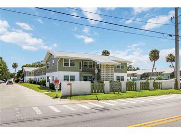 Charming two-story condo with well-maintained landscaping and signage at 840 Molat Square at 840 Center Ave # 80, Daytona Beach, FL 32117