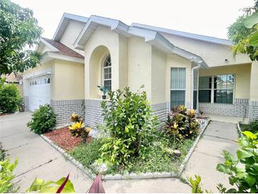 Charming single-Gathering home with lush landscaping and a welcoming front entrance at 162 Seneca Point Trl, Kissimmee, FL 34746