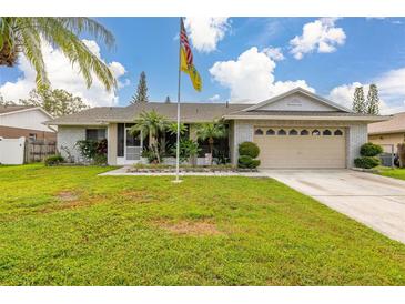 Charming single-story home with well-maintained lawn, brick accents, and a welcoming two-car garage at 2569 Tandori Cir, Orlando, FL 32837