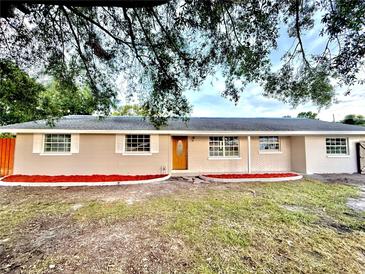 Charming single-story home featuring a brick and siding facade and manicured red mulch landscaping at 4917 Easton St, Lake Wales, FL 33859