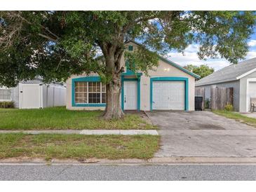 Charming single-story home with a well-maintained lawn, and a one car garage at 1506 Brookebridge Dr, Orlando, FL 32825