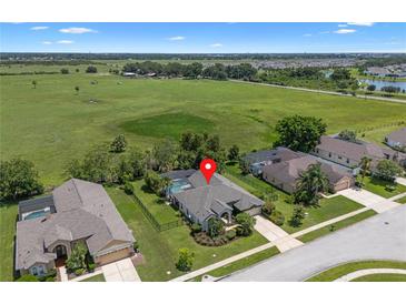 Beautiful aerial view of home, pool, and surroundings at 1525 Gants Cir, Kissimmee, FL 34744