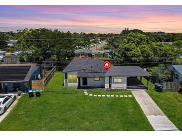 Charming single-story home with well-maintained lawn and inviting carport at 2806 Bonneville Dr, Orlando, FL 32826