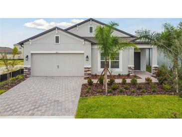 Attractive one-story home with a two-car garage and landscaped front yard at 4837 Foxglove Cir, Lakeland, FL 33811