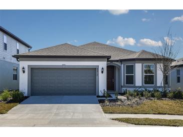 Charming single-story home featuring a two-car garage, neutral tones, and well-maintained landscaping at 4412 Sw 84Th Street Rd, Ocala, FL 34476